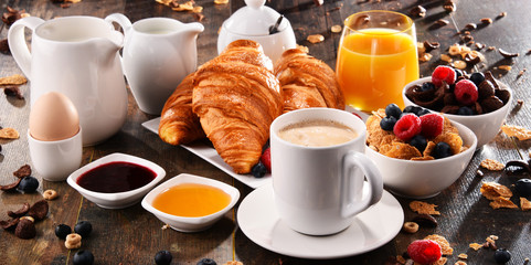 Breakfast served with coffee, juice, croissants and fruits