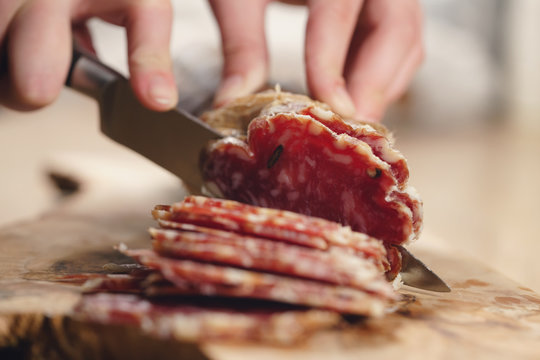 slicing italian salame close up shot