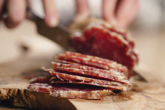 Slicing Italian Salame Close Up Shot