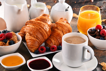 Breakfast served with coffee, juice, croissants and fruits