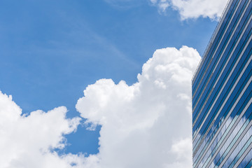 Exterior glass office building with sky and cloud