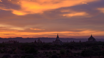 Fototapeta na wymiar Bagan sunset. From a shrine's roof over the valley of temples, the Unesco-listed site of Bagan is lit by the sunset.