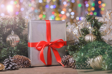 Christmas and New Year, gifts with blurred background of garlands, close up  with free copy space