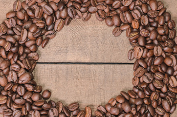 Frame of coffee beans with free space for text, top view