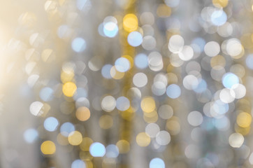 Background of strongly blurred lights of garlands, Christmass