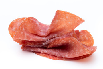 Salami slices isolated on white background.