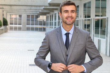 Elegant businessman adjusting his suit