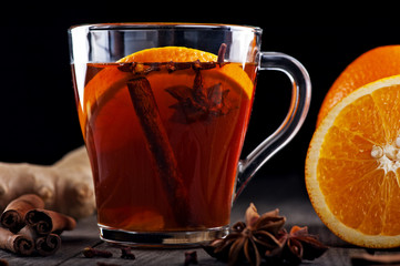 hot tea with spices and oranges