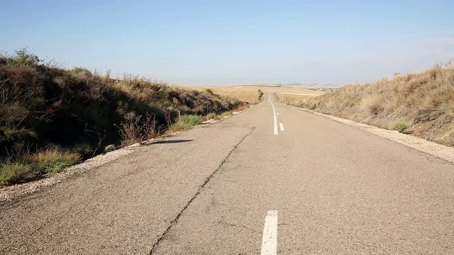paved road next to Castrillo Mota de Judios, province of Burgos, Spain
