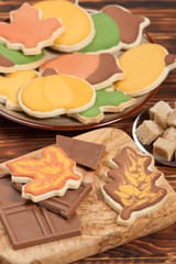 Autumn Style. Homebaked Decorated Sugar Cookies With Royal Icing. Olive Tree Wooden Board. Chocolate.