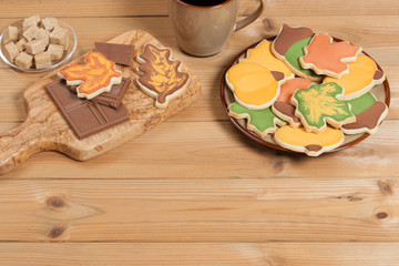 Autumn Style. Homebaked Decorated Sugar Cookies With Royal Icing. Olive Tree Wooden Board. Chocolate.