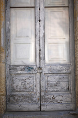 A fragment of an ancient wooden massive door in a medieval building