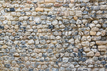 Background old brickwork with stones of different color