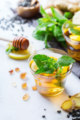 Japanese chinese tea in glass with lemon ginger mint