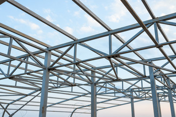 metal construction for future roof on sky background
