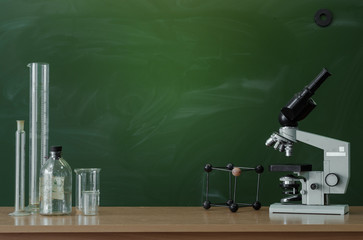 Teacher or student desk table. Education background. Education concept. Microscope, beakers, vials...