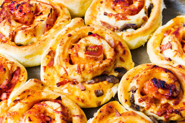 Rolled pizza pastry on baking paper