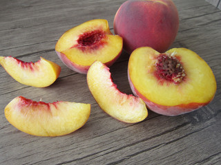 peaches on a wooden floor.fruits