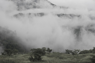 Abstract blurred morning sunset fog and cloud mountain valley landscape