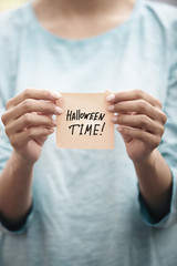 Halloween time text on a sticky paper