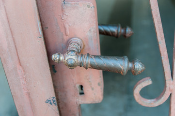 Old iron door handle close up.