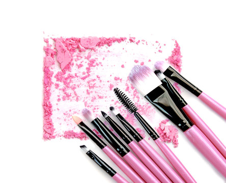 Pink powder and blush set on white background