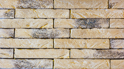 The texture of the tiles of the facade . Lining material