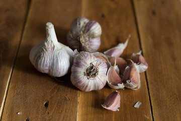 Garlic on wooden background in natural light