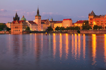 Fototapeta na wymiar Summer sunset panorama of the Old Town and Vltava river in Prague. Czech Republic