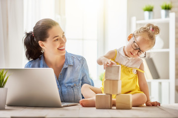 mother with toddler working