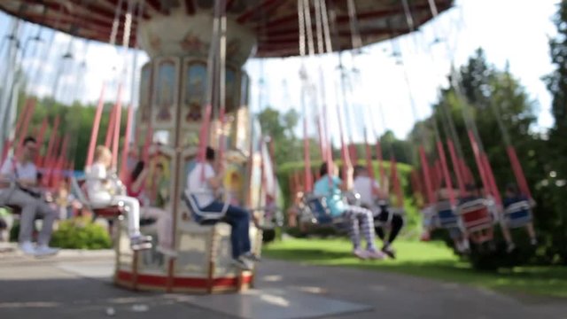 Amusement Park, People Ride the Carousel