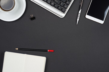 Business objects on a black desk.
