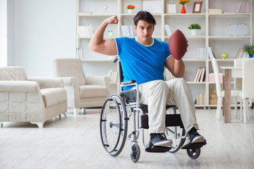 Young man american football player recovering on wheelchair