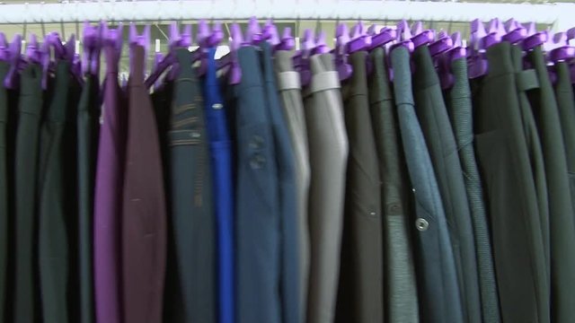 Old-fashioned ugly horrible women clothing on rack in collective farm Uryupinsk. Anti-advertising. How not to do.