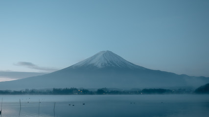Fototapeta na wymiar beauty night landscape view from kawaguchi lake with sky and fuji mountain range background with motion blur from group of duck from japan