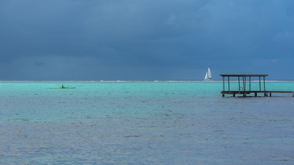 Polynesia, Moorea, panorama of the lagoon with a boat and a kayak
