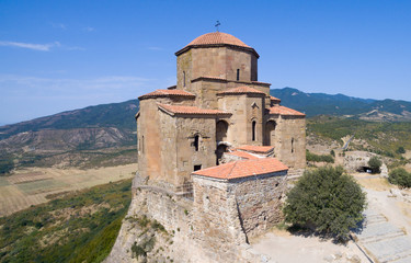 Fototapeta na wymiar famous Jvari Monastery in sunny summer weather aerial view