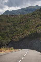 Corsica, 03/09/2017: la Torre di Seneca, antica torre genovese del XVI secolo nel cuore del Capo Corso, vista dalla strada tortuosa che porta a nord