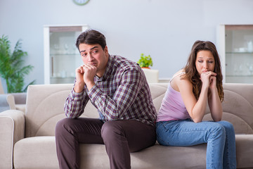 Fototapeta premium Young family in broken relationship concept