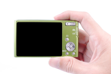 Hand holding a modern digital camera on white background