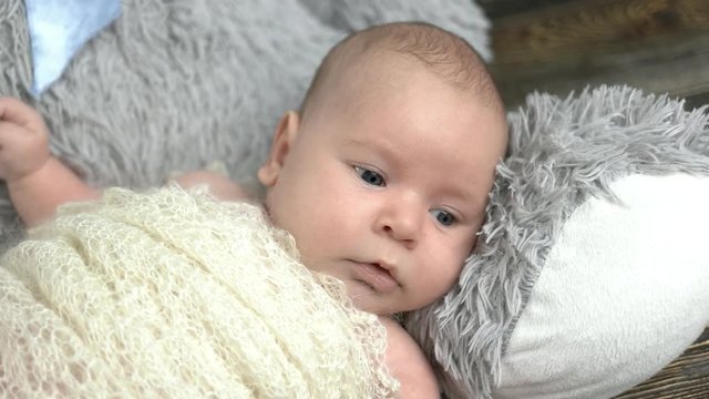 Adorable small child. Caucasian baby close up. Infant behavior and development.