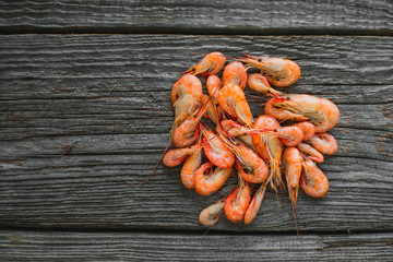 On a wooden table beautifully arranged shrimp