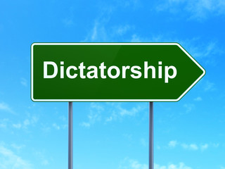 Political concept: Dictatorship on road sign background