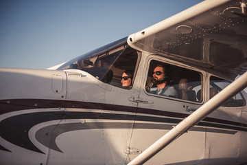 Fototapeta na wymiar Couple in aircraft