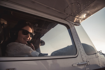 Woman-pilot in aircraft