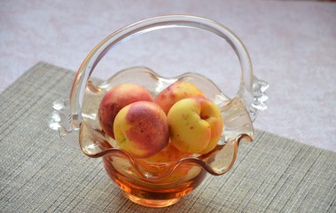 nectarines and peaches in backet. peach, nectarine cut in half stone