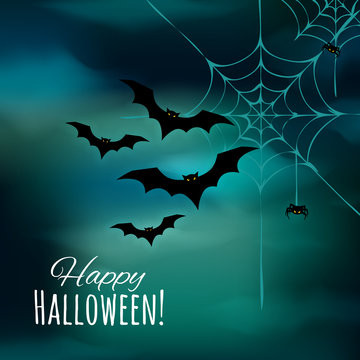 Happy Halloween background with black silhouettes bats, spider web and small spider.