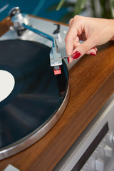 the image of resting sexy woman listening to vinyl