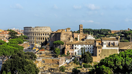 Fototapeta na wymiar Panoramic view of Rome, Italy with the Colosseum and ruins of the Forum Romanum.