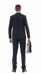 rear view.confident businessman with briefcase